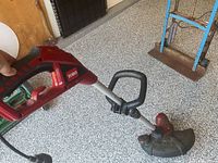 Handle and auxiliary grip of Toro electric trimmer