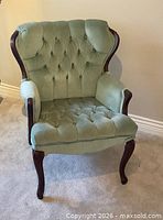 Full view of upholstered Queen Anne armchair