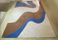 Full view of rug showing abstract pattern and colors