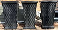 three black resin wicker-pattern planters front view