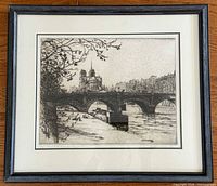 Full view of framed etching showing artwork, mat and wood frame