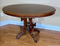 Full view of oval mahogany pedestal table