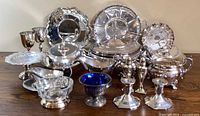Entire lot of assorted silver-plated serveware displayed together