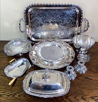 All ten silver-plated pieces grouped on table