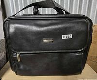 Front view showing Renwick plaque, exterior zip pocket, overall condition