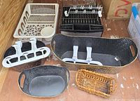 assorted dish racks, hooks and bins on floor