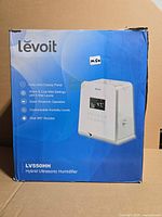 Front of retail box showing Levoit LV550HH humidifier image and branding
