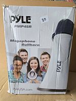 Front of retail box showing model Pyle PMP45R megaphone