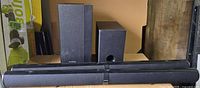 Group shot of two soundbars and two subwoofers