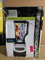 Retail box of Ninja Professional Blender, shows product and wattage