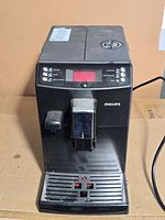 Front view of Philips espresso machine showing controls, drip tray and overall condition