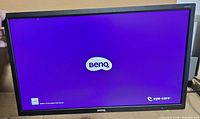 Front view showing BenQ logo on purple screen