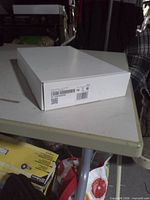 White sealed box with barcode label showing ADT touchscreen panel