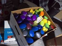 Top view of bankers box filled with assorted coloured cone air fresheners