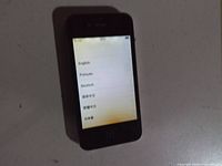 Front view of black Apple iPhone showing setup screen