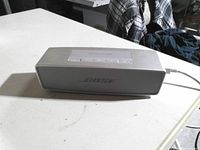 Front view of silver Bose SoundLink Mini speaker with Bose logo