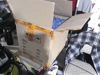 Closed master shipping carton with security tape