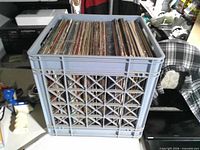 overall view of plastic crate filled with vinyl records