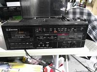 Front and top view of Emerson stereo showing tuner, cassette deck, turntable and overall wear