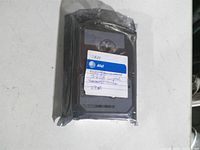Front view of hard drive in anti-static bag with AT&T service label