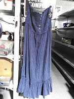 Front view of blue sleeveless maxi dress hanging