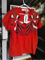 Front view showing colour and appliqué design