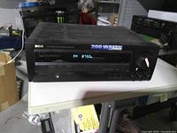 Front view of powered-on receiver showing display and controls