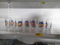 Eight glasses lined on shelf showing full set