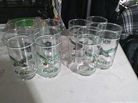 Group shot of all 11 Eagles glasses on table