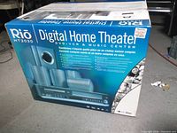 Retail box showing Rio HT2030 Digital Home Theater system