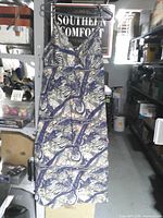 Full view of sleeveless maxi dress hanging