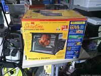 Front view of unopened Showtime Rotisserie & BBQ Oven box