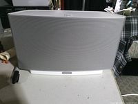 Front view of Sonos Play:5 speaker on table with power cord