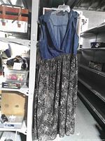 Full view of dress hanging, showing bodice and animal print skirt