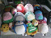 All plush toys laid out on table