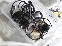 Basket showing all three wired USB webcams with cables