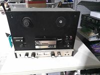 Front view showing spindles, controls, meter