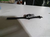 Watch with car case attached on strap