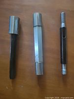 three gauges laid out on surface