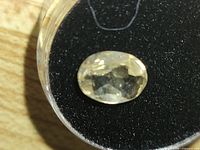 Top view of oval lemon citrine gemstone in display case