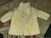 Front view of cream mohair child’s jacket showing buttons and overall texture