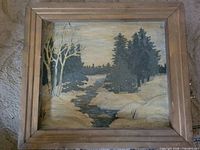 Full view of framed landscape painting