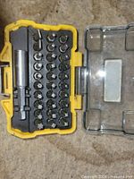 Open DeWalt case showing bits and holders