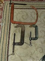 All three clamps laid out for size comparison