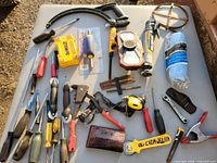 Overview of assorted tools and supplies spread on table