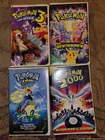 Front covers of all four Pokémon VHS tapes