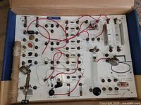 Full view of electronic workshop board inside box showing all components and wiring