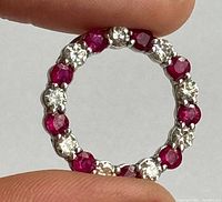 Close-up of pendant showing alternating rubies and diamonds