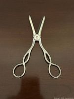 Front view of sterling silver grape shears showing handle design