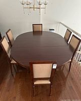 Top view of assembled oval dining table with leaf inserted
